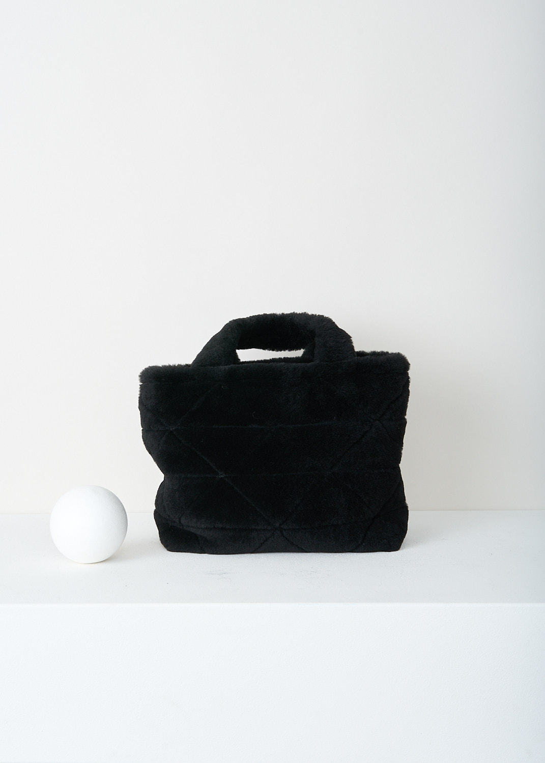 Prada, Black shearling shopper, 2EC9_MONTONE_1BG378_F0002_NERO, Black, Back, This plush black shearling tote bag has padded top handles and the signature quilted detailing. This bag has the brand's triangle logo in silver-tone hardware. The bag comes with a detachable shoulder strap and matching shearling pouch. 
