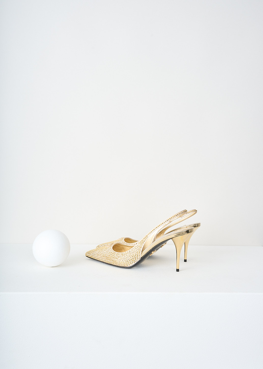 Prada, Gold crystal slingback pumps, 2AWL_CRYSTAL_1I021N_F0522_PLATINO, Gold, Back, These all-over gold-tone crystal embellished slingback pumps have a pointed toe with the brand' signature triangle logo on them. These pumps have an elasticated ankle strap and a small heel.
