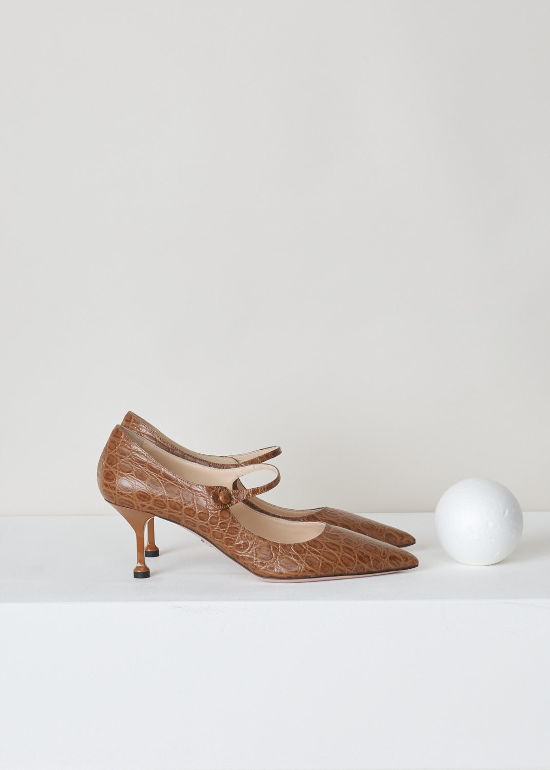 Prada, Croc-embossed leather mary jane pumps, ST_cocco_1I491L_F0314_visone, brown, side, Croc-embossed pumps featuring pointed toes and short stiletto heels. Also a leather strip crossing the vamp hold the foot in place. 

Heel height: 7 cm / 2.75 inch. 