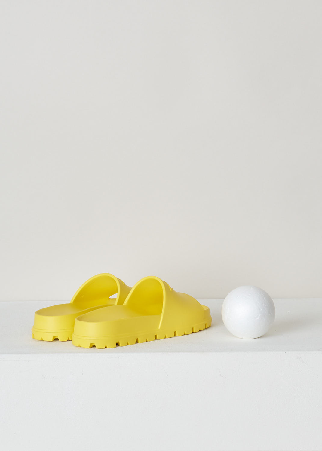 PRADA, YELLOW SLIDES, 1XX626_3LKV_F0377_3_99_F_020_CALZATURE_DONNA_SOLE, Yellow, Back, These yellow slip-on style slides have a round open toe with an embossed logo on the front. These slides have ridged soles. 