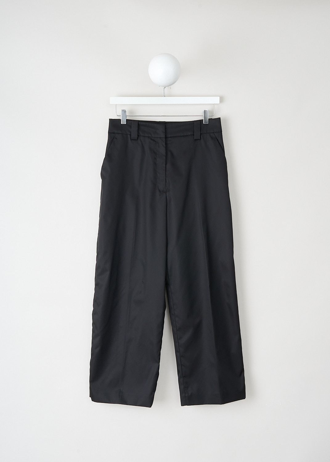Black Prada wide-leg pants with relaxed fit, waistband with belt loops and slanted front pockets at Kiki's Stocksale Maastricht designer outlet.