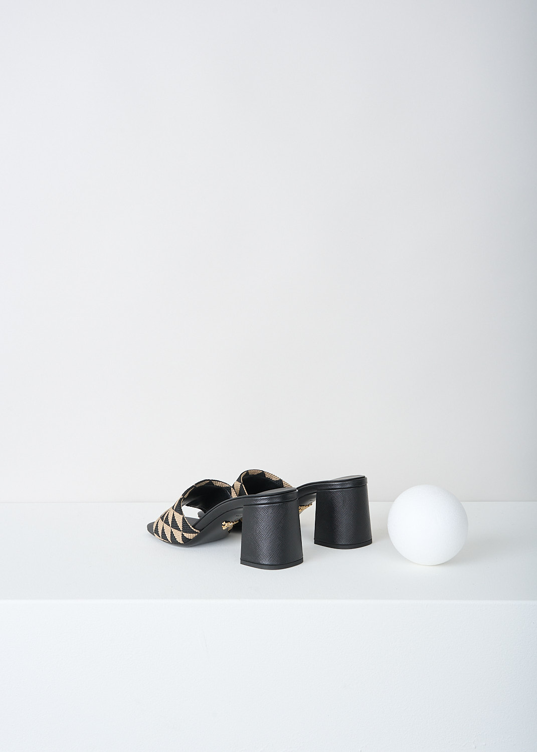 Prada, Black-and-beige triangolo mules, 3LK6_TRIANGOLO_JACQUARD_1XX637_F0Y30_NERO_CORDA_065, Black, Beige, Print, Back, These slip-on mules have a broad strap with a back-and-beige triangolo jacquard print. On the strap, the brand's triangle logo can be found in gold-tone metal. 
