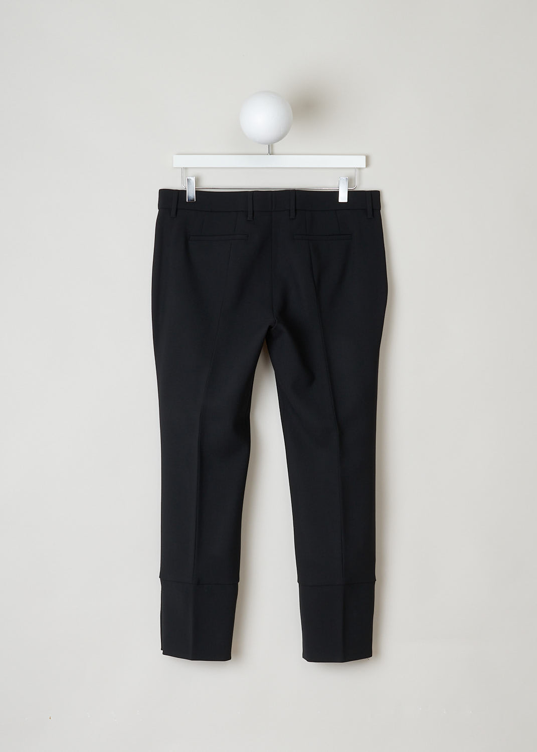Prada, Black wool pants, Tela_Natte_STR_P2291_F0002_Nero, Black, Back, These black wool pants have a waistband with belt loops and a concealed front zip closure. The pant legs have pressed creases and small buttoned slits 
