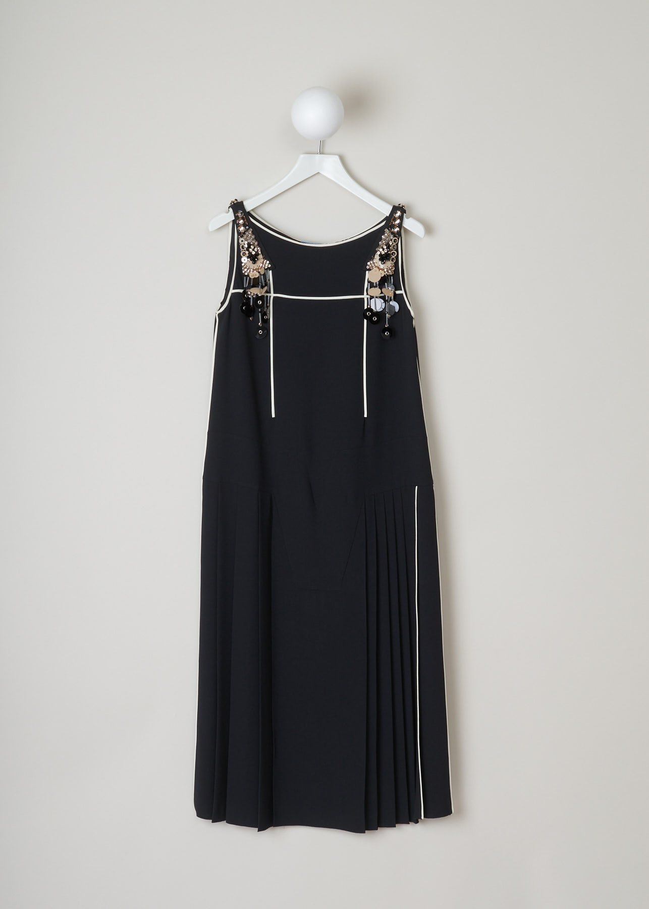 Prada, Black bead-and-sequin embellished dress, sable_piping_r_P33F7R_F0SJ2_nero_avorio_gris, Black, Front, This black dress with white trimming has a bead and sequin embellished shoulder. There is a concealed zipper on the left side of the dress. The dress has a pleated flared skirt.
