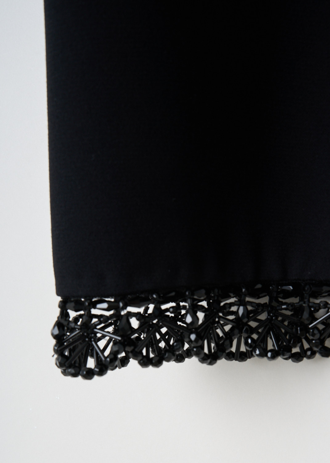 Prada, Black crepe sleeveless dress, 1M2N_CADY_RIC_CROCHE_P34I7R_F0806_NERO_NERO, Black, Detail 1, This black crepe sleeveless dress has a round bead-embellished neckline and a matching bead-embellished hem. In the back, a concealed centre zip functions as the closure. 


