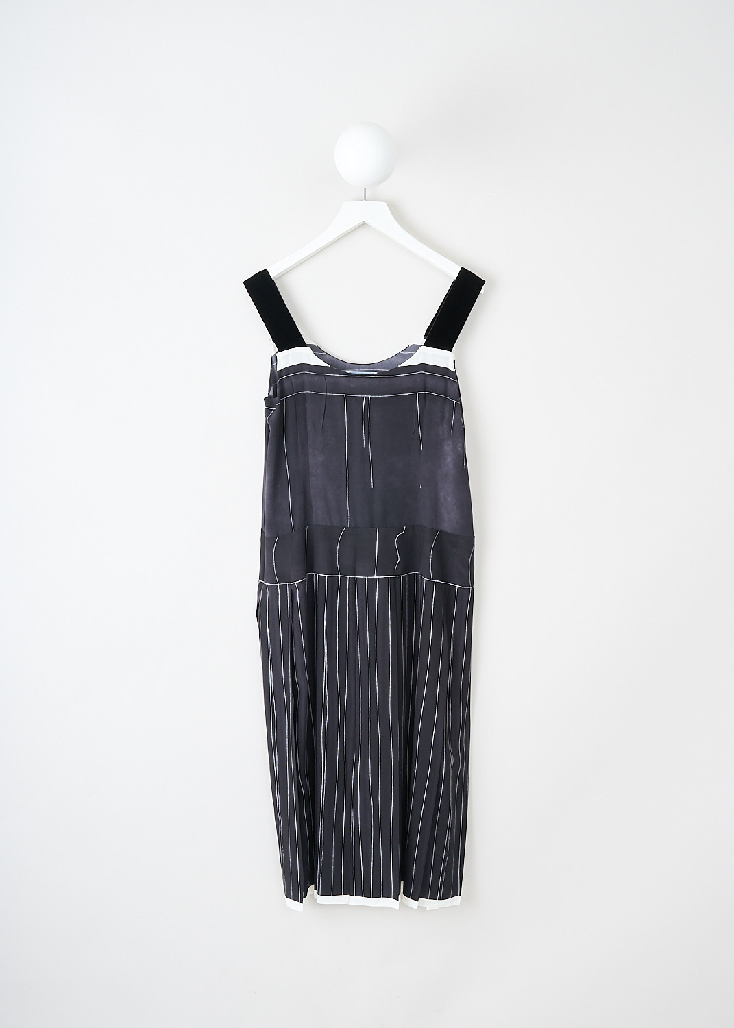 Prada, Black printed silk dress, 10R2_CREPEDECHINE_P3G58_F0002_NERO, Black, Back, This black silk dress has a printed white pattern of thin lines. The dress has broad velvet shoulder straps and a round neckline. On the front, the brand's signature lettering logo van be found. A concealed side zip functions as the closure. The dress has a dropped-waist silhouette. 
