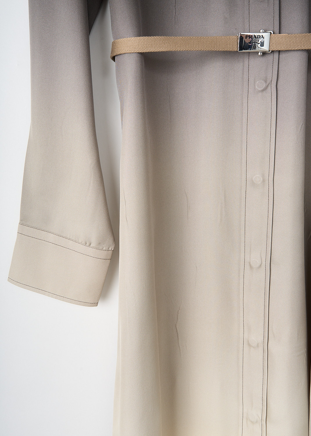 Close-up of silk ombré fabric on Prada midi shirt dress with gradient colour effect and soft sheen.