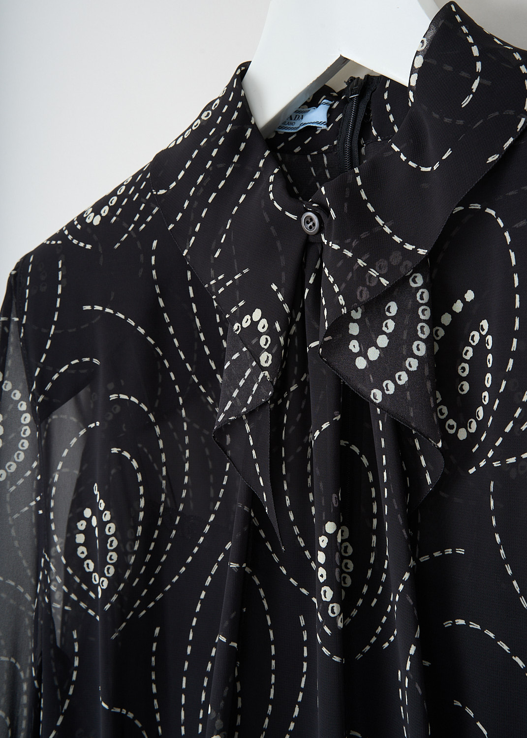 Detail of the Black and white Georgette dress by designer Prada at Kiki's Stocksale Maastricht