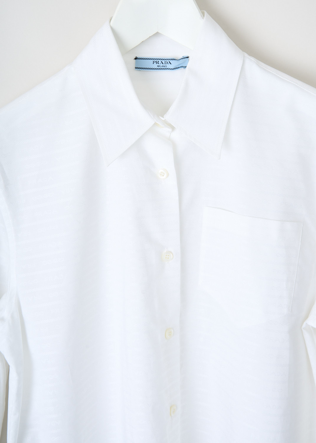 Fabric detail of a luxury designer blouse by Prada available at Kiki's Stocksale