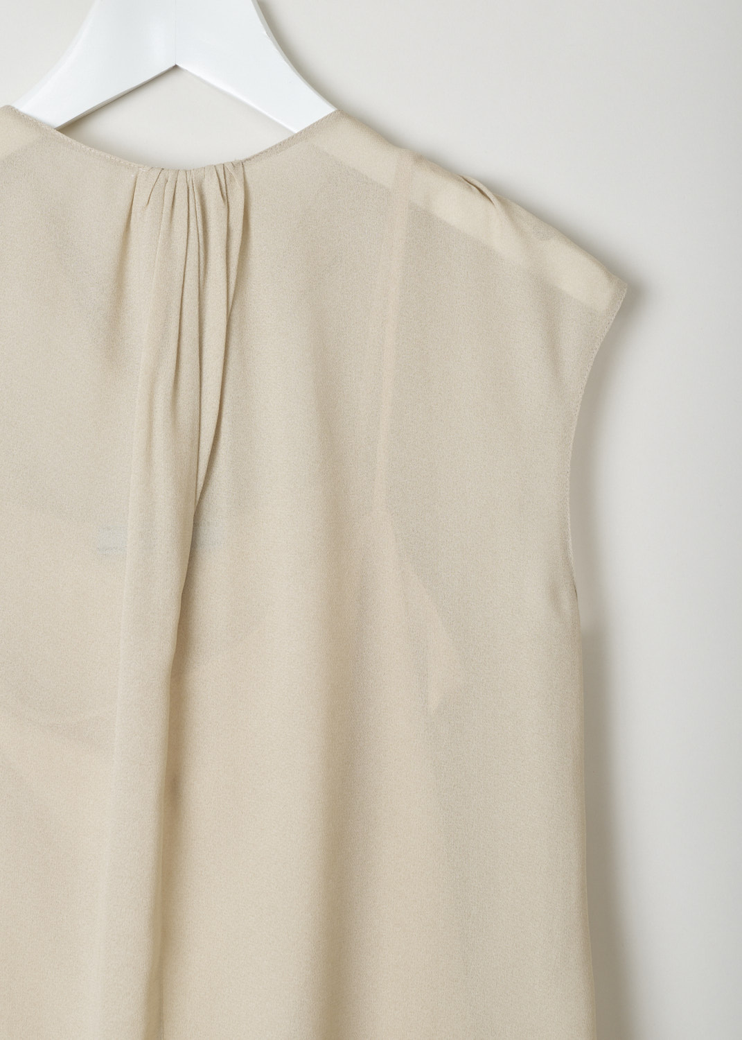 Prada, Sand coloured sleeveless top with self-tie detail, crepe_sable_P925H_F0036_sabbia, beige, detail, A lovely sleeveless design, comes with a round neckline on the front, and a scoop neck on the back, where also a self-tie feature can be found. Furthermore, tiny crystal pleats decorate the neckline and flow down the front 