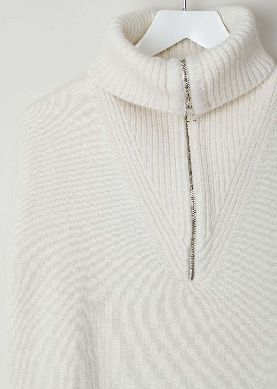PRINGLE OF SCOTLAND, CREAM COLORED QUARTER ZIP SWEATER, WTK059_7215_CREAM, White, Detail, Cream colored turtleneck sweater. The neck has a silver-toned quarter zip and a ribbed finish. That same ribbed finish can be found on the cuffs and the hemline. Small side slits can be found on both the cuffs and the hemline.
