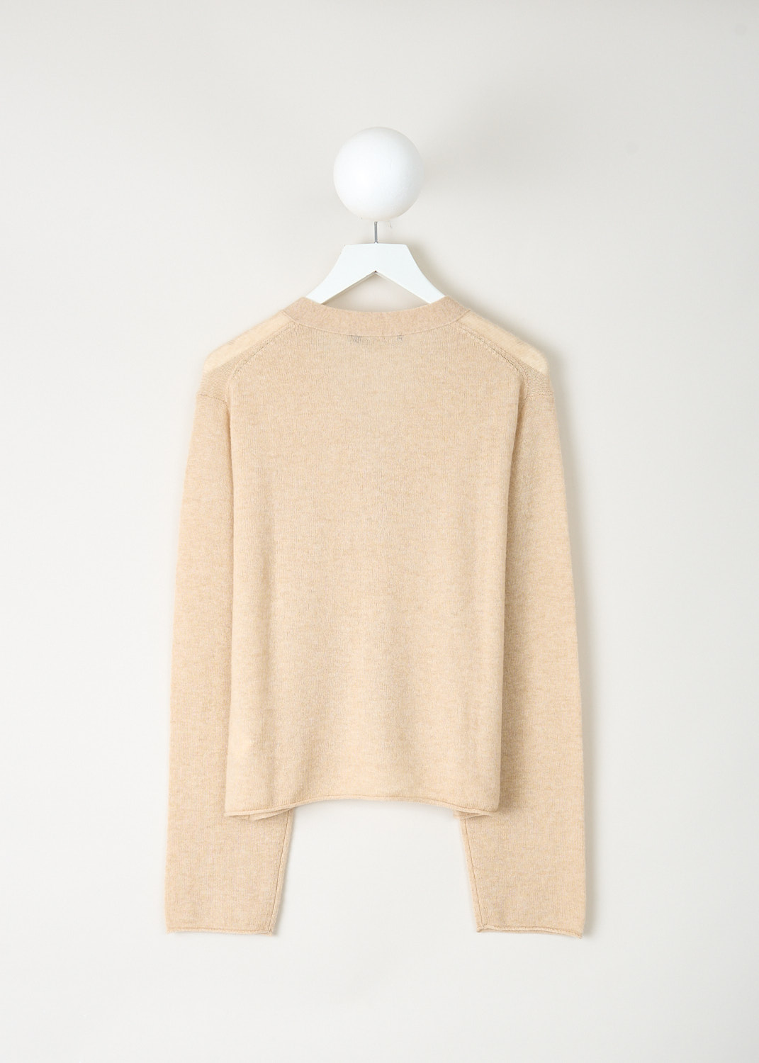 Back view of the Sahara beige Madrid cardigan showcasing its clean, timeless silhouette and luxurious wool-cashmere construction – designer sale item at Kiki’s Stocksale boutique Maastricht.