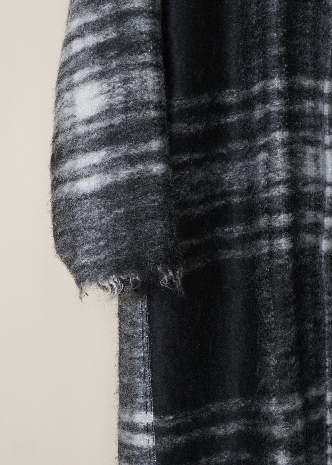 SOFIE Dâ€™HOORE, LONG BLACK AND WHITE TARTAN CAY COAT, CAY_WOMO_BLACK_TARTAN, Black, White, Print, Detail 1, This long black and white tartan Cay coat has a spread collar and a front button closure. The long sleeves have slightly dropped shoulders and a raw edged cuff. In the front, the coat has on-seam slanted pockets. The coat has a straight raw edged hemline. The coat is fully lined and has a single inner pocket. 
