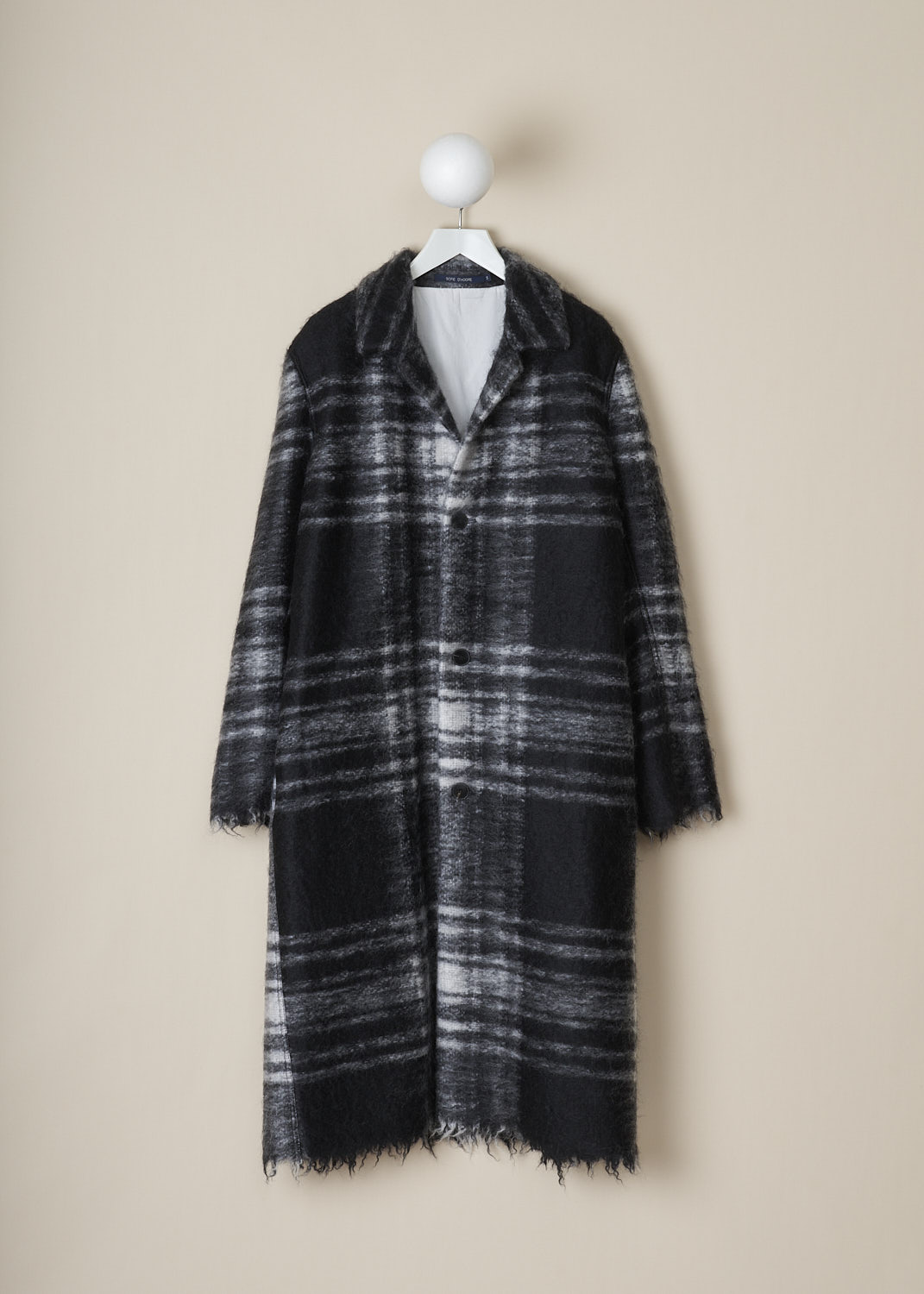 SOFIE Dâ€™HOORE, LONG BLACK AND WHITE TARTAN CAY COAT, CAY_WOMO_BLACK_TARTAN, Black, White, Print, Front, This long black and white tartan Cay coat has a spread collar and a front button closure. The long sleeves have slightly dropped shoulders and a raw edged cuff. In the front, the coat has on-seam slanted pockets. The coat has a straight raw edged hemline. The coat is fully lined and has a single inner pocket. 
