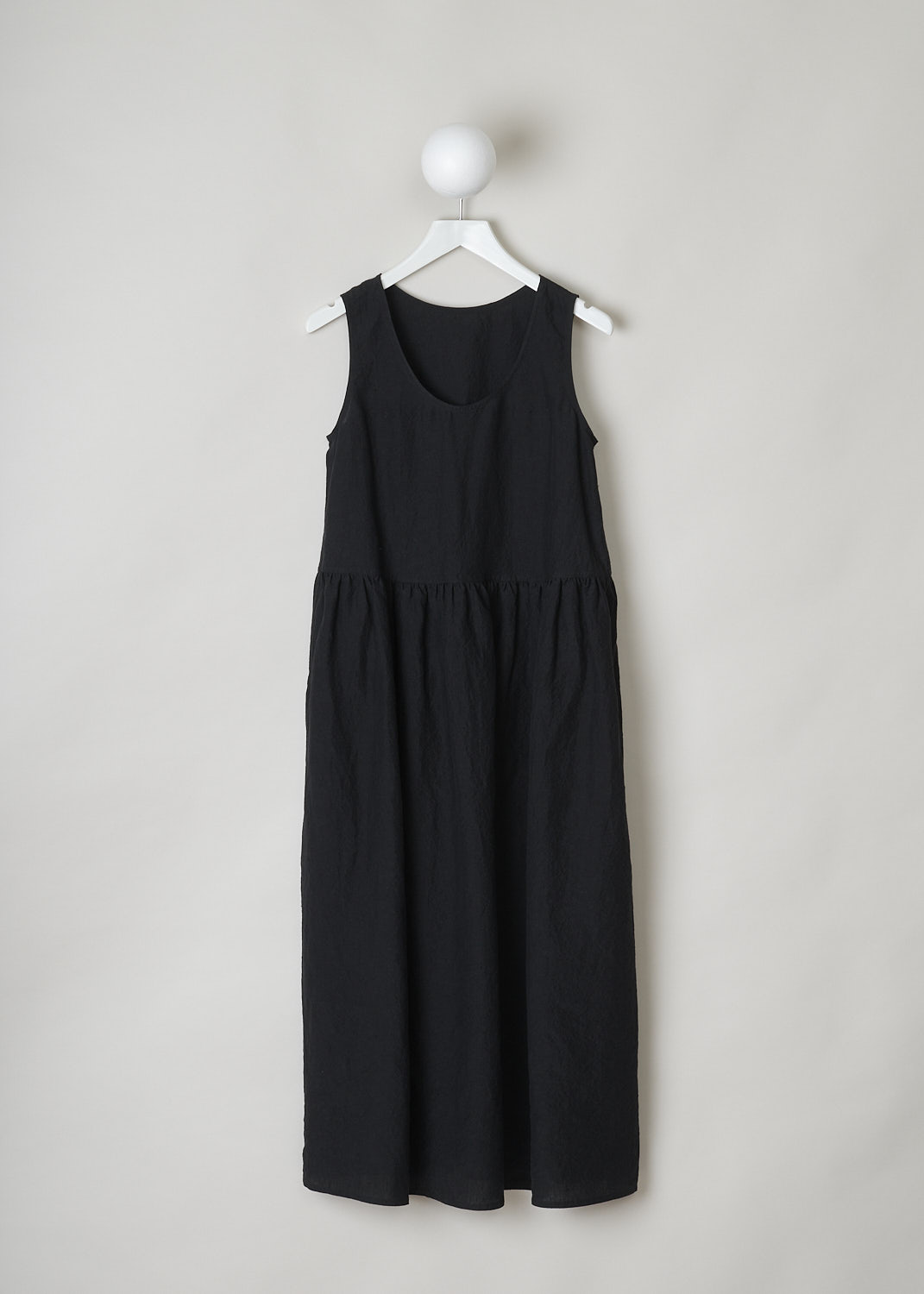 SOFIE Dâ€™HOORE, BLACK LINEN DANDLE DRESS, DANDLE_LIFE_BLACK, Black, Front, This black sleeveless dress has U-neckline. The dress has a wide A-line silhouette. A straight crystal pleated hemline separates the bodice from the midi length skirt. Concealed slanted pockets can be found in the side seam. 
