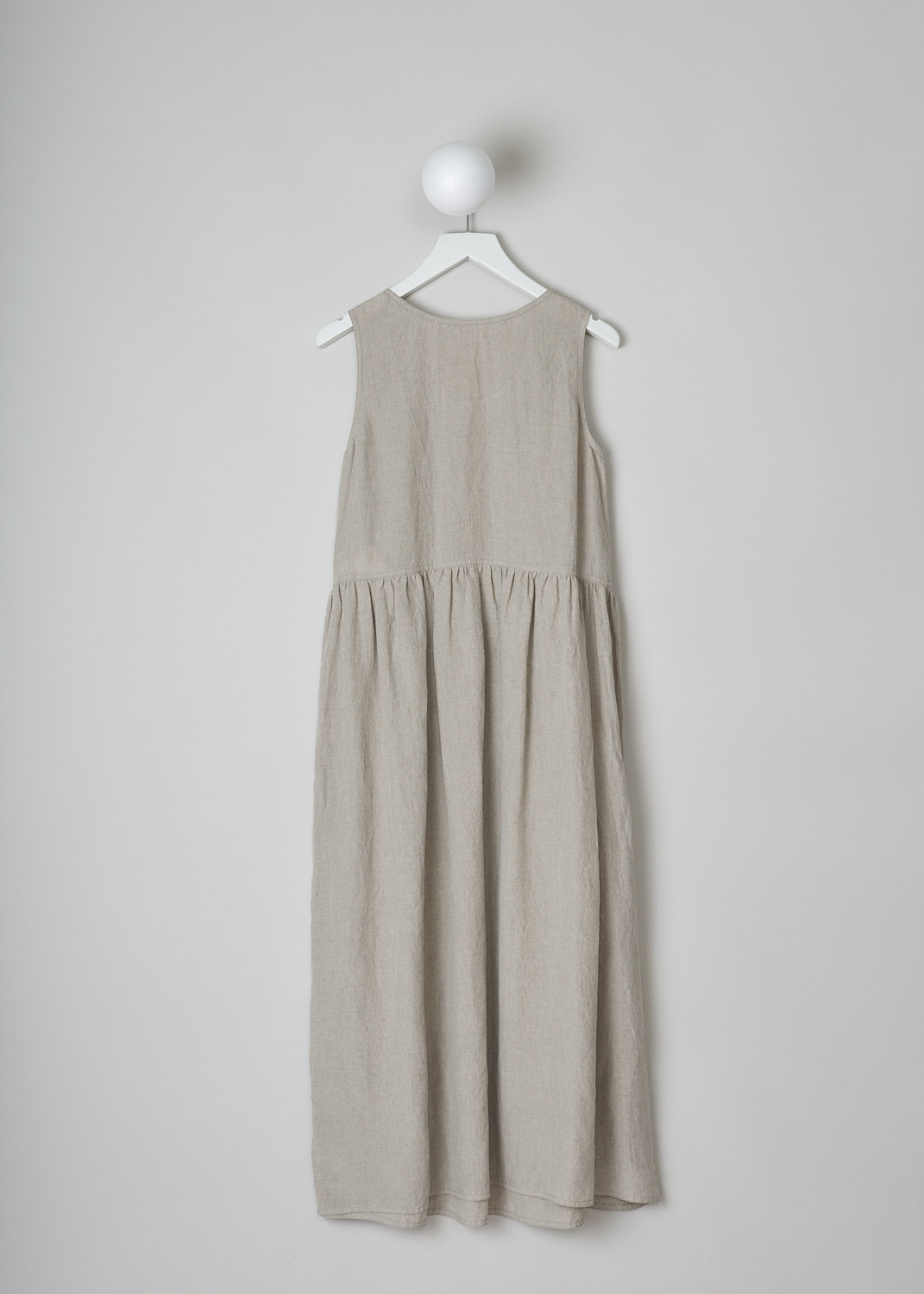 SOFIE D’HOORE, BEIGE LINEN DRESS, DANDLE_LIFE_NATURAL, Beige, Grey, Back, This beige sleeveless dress has U-neckline. The dress has a wide A-line silhouette. A straight crystal pleated hemline separates the bodice from the midi length skirt. Concealed slanted pockets can be found in the side seam. 
