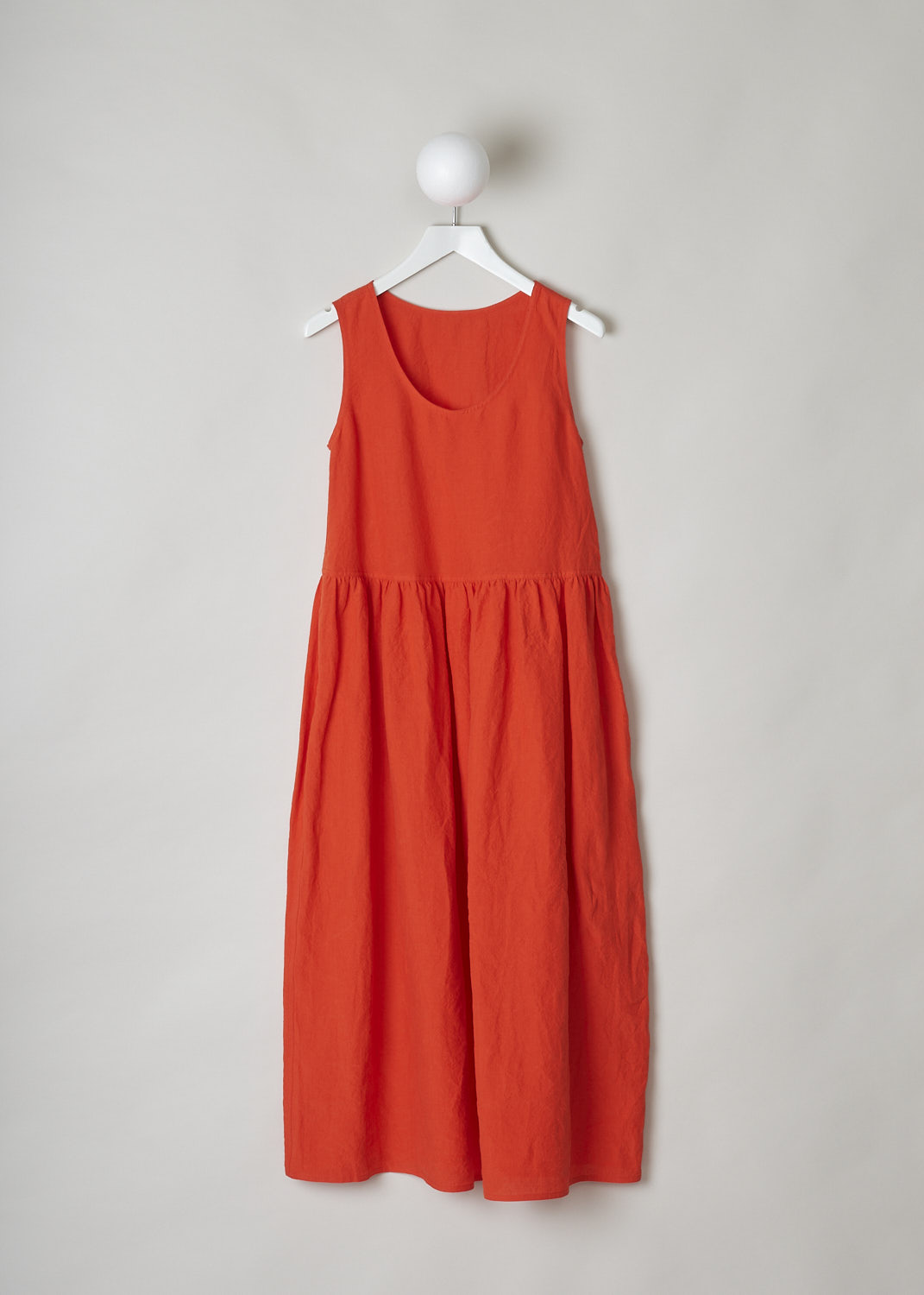 SOFIE Dâ€™HOORE, BRIGHT RED LINEN DRESS, DANDLE_LIFE_RED_PEPPER, Red, Front, This bright red sleeveless dress has U-neckline. The dress has a wide A-line silhouette. A straight crystal pleated hemline separates the bodice from the midi length skirt. Concealed slanted pockets can be found in the side seam. 
