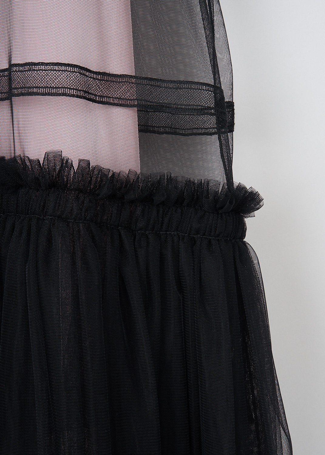 Sofie d'Hoore, Black tulle Dominic maxi dress, DOMINIC_NYCE_02_BLACK, Black, Pink, Detail 1, This black tulle Dominic maxi dress has a round neckline and short sleeves. The dress has a boxy bodice with embroidered detailing and a pleated skirt. The sheer tulle fabric creates a layered look with the detachable pink slip dress. 


