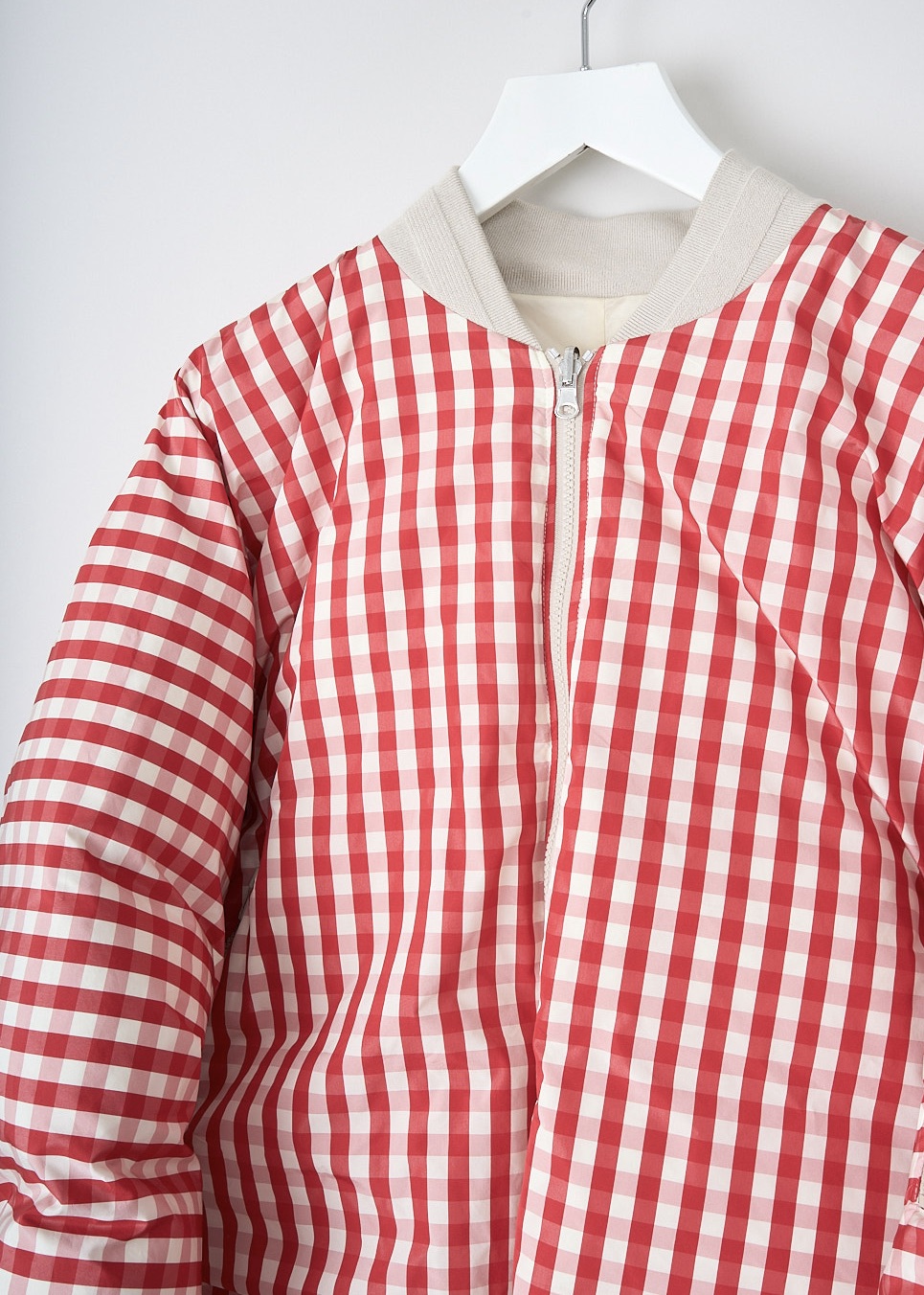 Sofie d'Hoore, Reversible bomber in red check/butter, ORIGIN_PAN_RED_CHECKS_BUTTER,  Red, Print, Beige, Detail, This reversible bomber has a red-and-white checkered print on one side and a solid butter color on the other side. Both sides have a rib-knit collar, a front zip closure and zipper slanted pockets. The jacket has an elasticated hem with adjustable tabs to cinch in the waist. 
