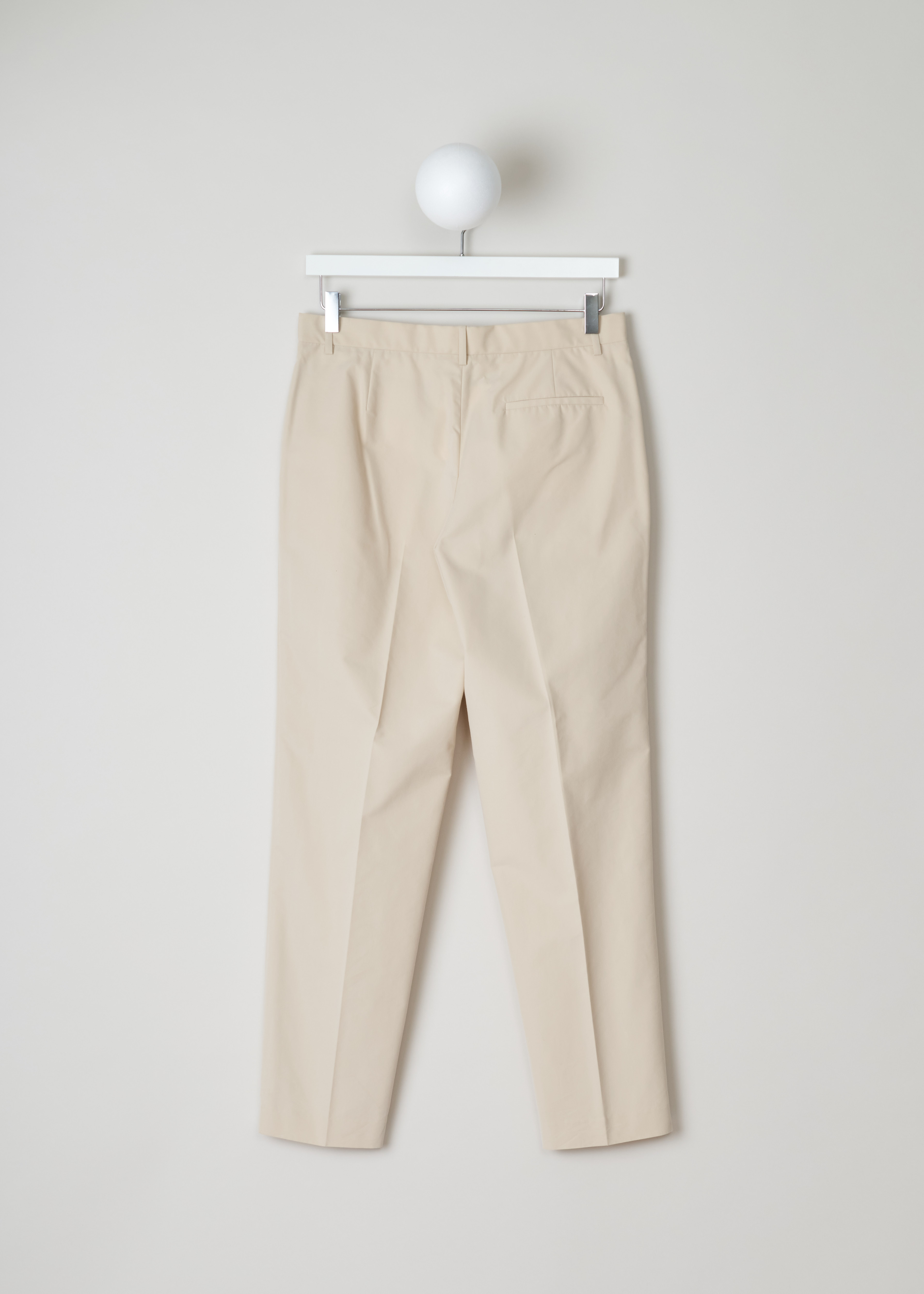 The Row mapion pant MAPION_PANT_1_595W534 pearl back. Pearl coloured Mapion pant with side pockets, welt pocket at the back with button closure, natural waist rise, straight legs and centre creases.â€ƒ