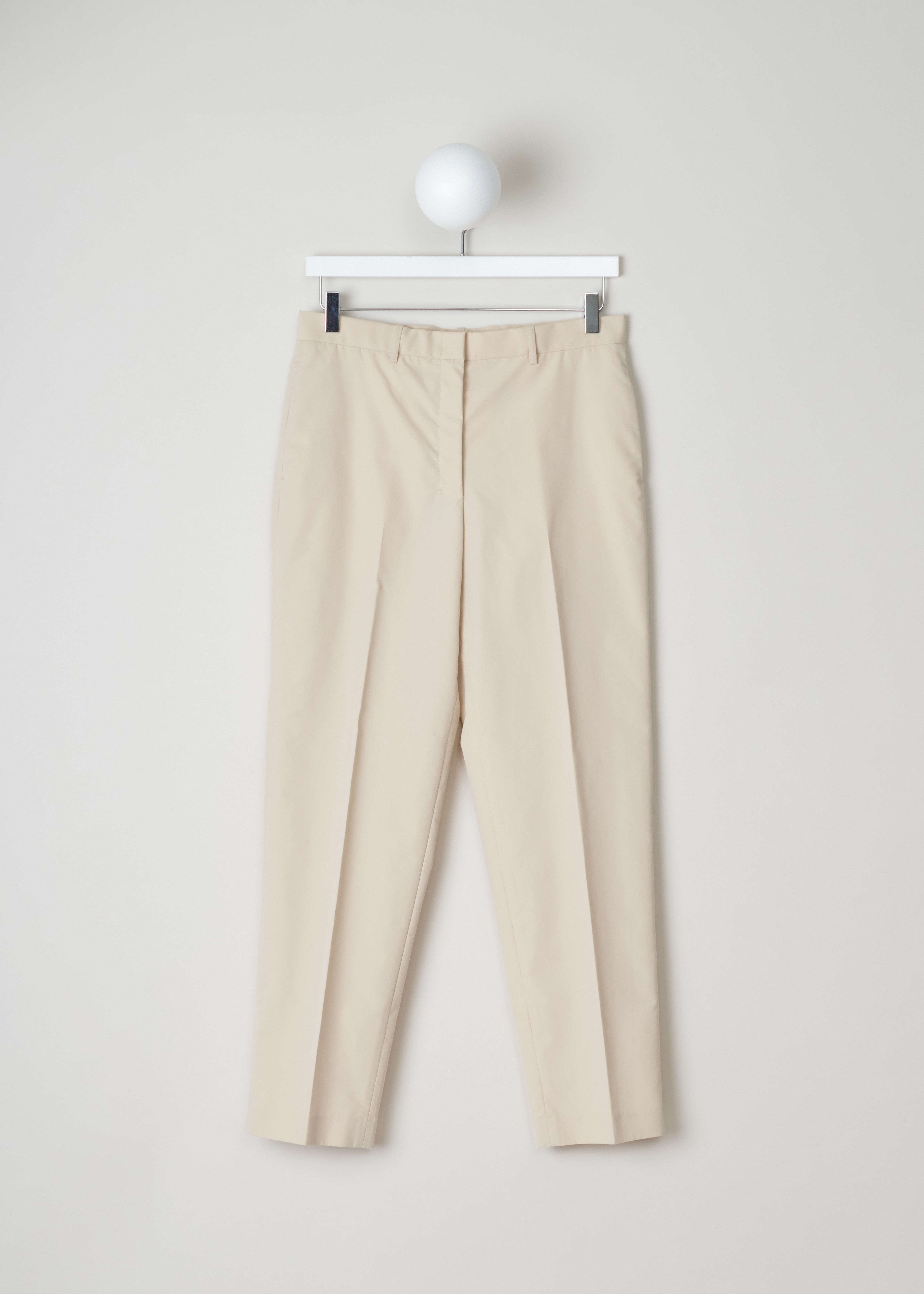The Row mapion pant MAPION_PANT_1_595W534 pearl front. Pearl coloured Mapion pant with side pockets, welt pocket at the back with button closure, natural waist rise, straight legs and centre creases.â€ƒ
