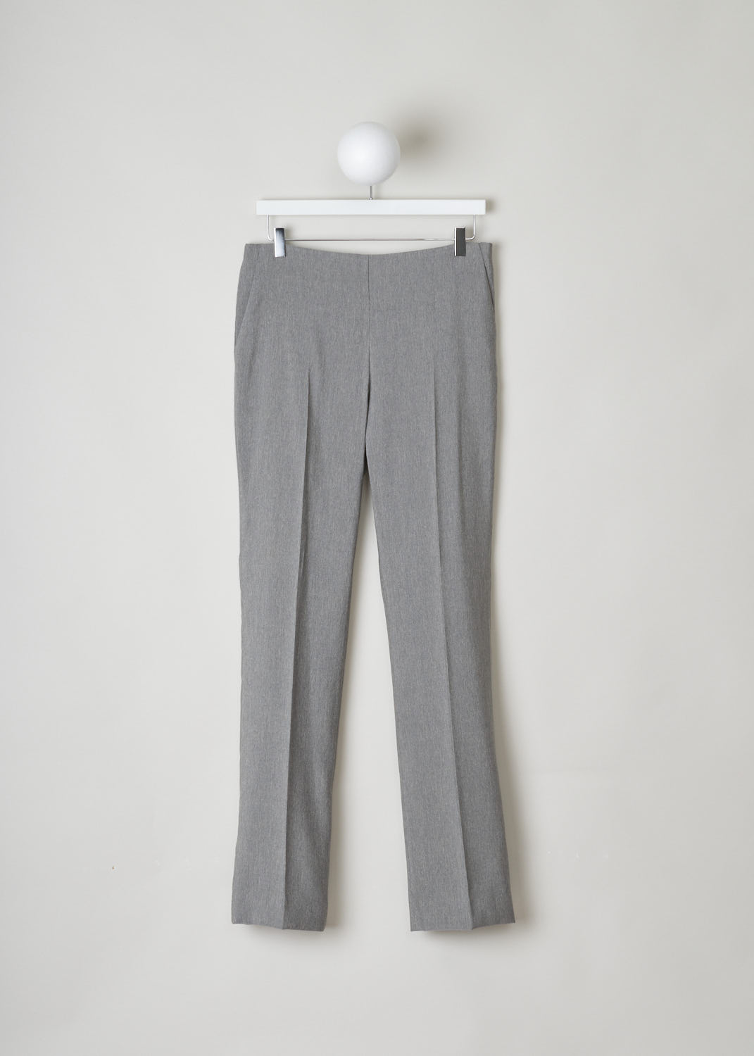 The Row, Heather grey pants without waistband, Ladan_pant_4775WI_030_MDM_GRY_MLNGE, Grey, front, Heather grey straight-fitted pants without waistband. These pants have slanted pockets on either side and an invisible zipper fastening on the side. In the front and back, along the length of the legs, centre creases can be found.
