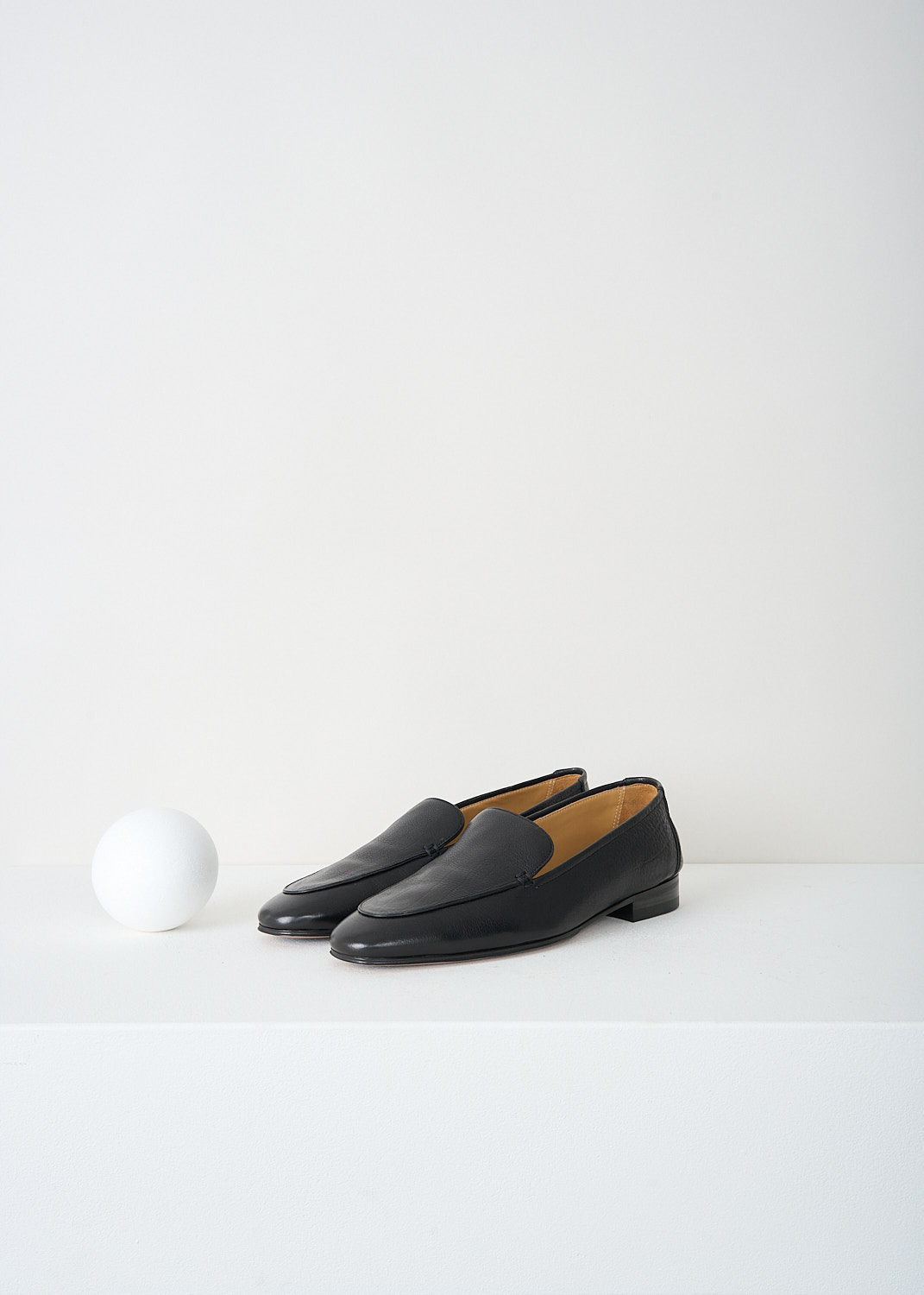 The Row, Adam loafers in Black, ADAM_F1017_BFG15_BLACK, 
Black, Front, These black grained leather Adam loafers have a round toe. Throughout, these loafers have a black piped trim. These loafers have a small stacked heel. 