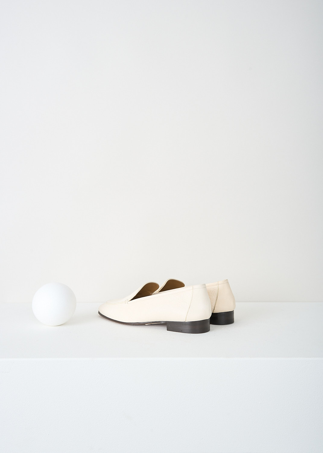 The Row, Adam loafers in Ivory, ADAM_F1017_BFG15_IVORY, Beige, White, Back, These Ivory grained leather Adam loafers have a round toe. Throughout, these loafers have a matching piped trim. These loafers have a small stacked heel. 
