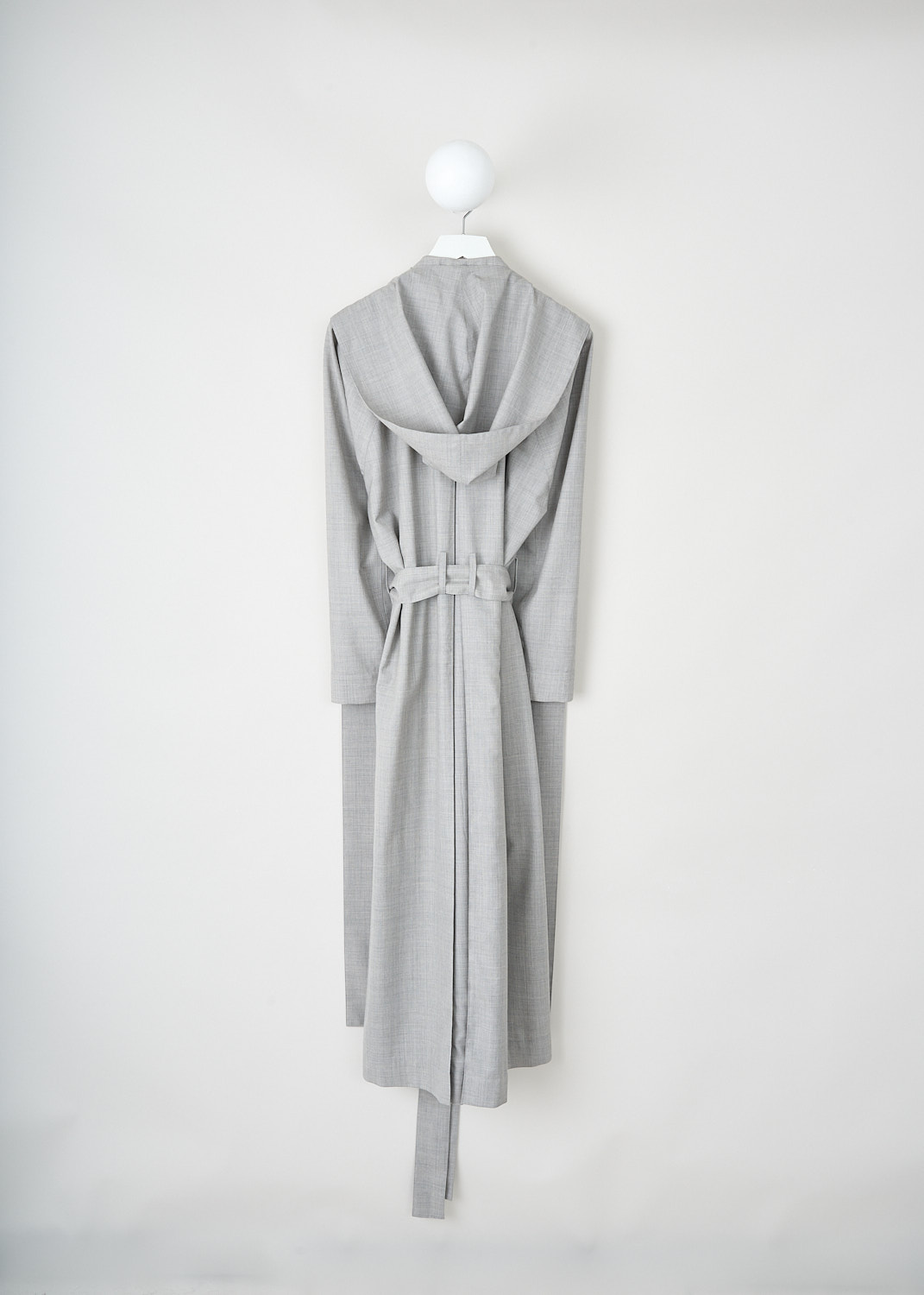 The Row, Badva coat in Grey Melange, BADVA_COAT_6903_W2453_GREY_MELANGE, Grey, Back, This Badva coat in Grey Melange has a detachable hood with long panels. Beneath the panels, the coat has a notched lapel. Around the waist, a matching fabric belt can be used to cinch in the waist. The coat is designed for a loose fit.
