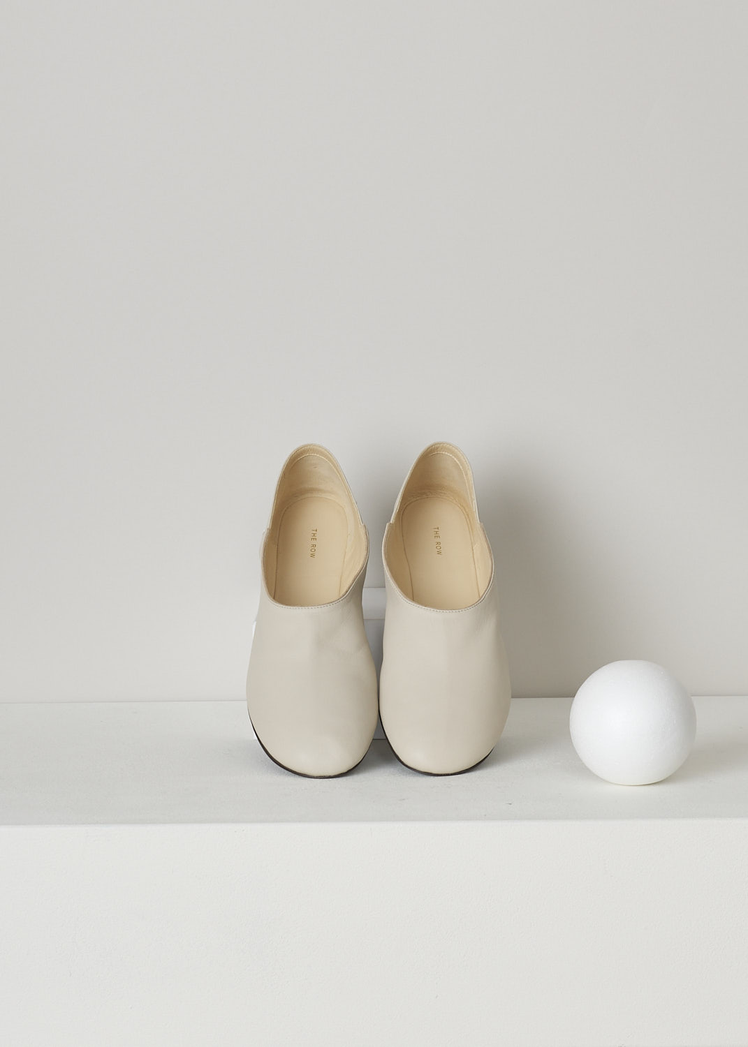 THE ROW, PEARL GREY BOHEME SLIPPERS, F1100_N61_PRG_PEARL_GREY, Grey, Beige, Top, These pearl grey Boheme slip-on slippers are made from smooth supple leather. These slippers features a notched detail along the topline and a high rounded toe vamp.
  
