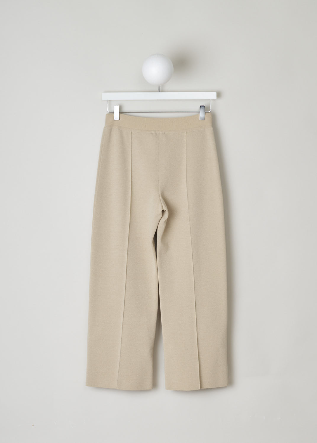 THE ROW, NUDE TAPERED TROUSERS, MARIA_PANT_3374Y205_NUDE, Beige, Back, These nude slip-on trousers feature an elasticated waistline. The trousers are form fitting throughout. Centre seam can be found front and back, creating a paneled look.
