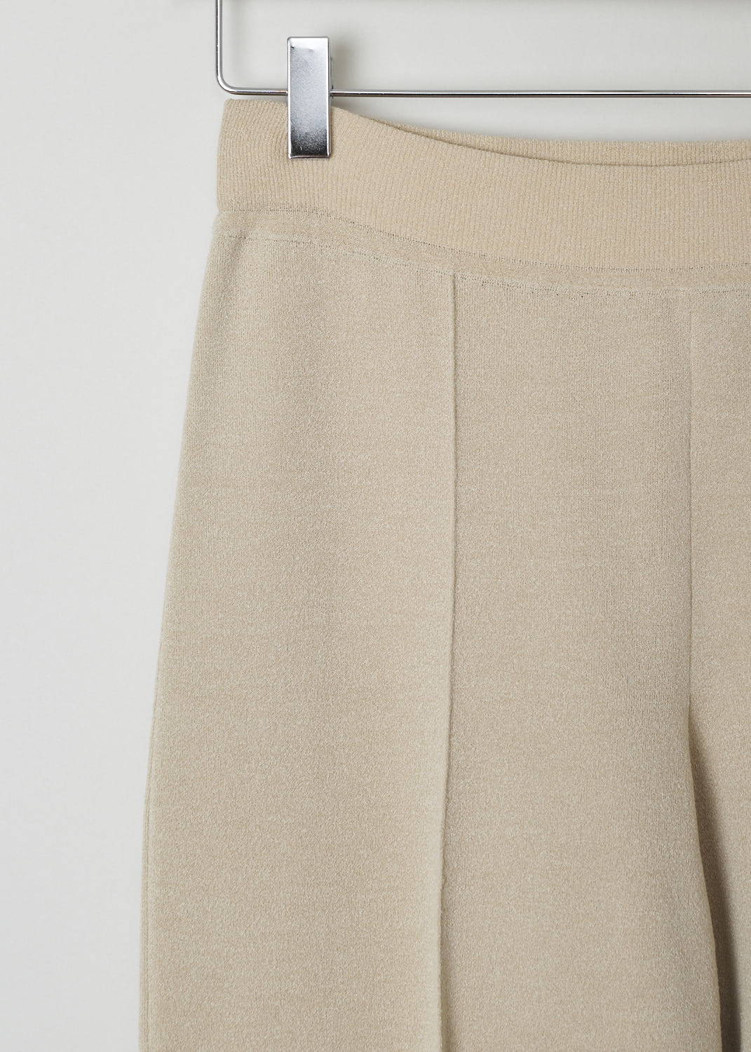 THE ROW, NUDE TAPERED TROUSERS, MARIA_PANT_3374Y205_NUDE, Beige, Detail, These nude slip-on trousers feature an elasticated waistline. The trousers are form fitting throughout. Centre seam can be found front and back, creating a paneled look.
