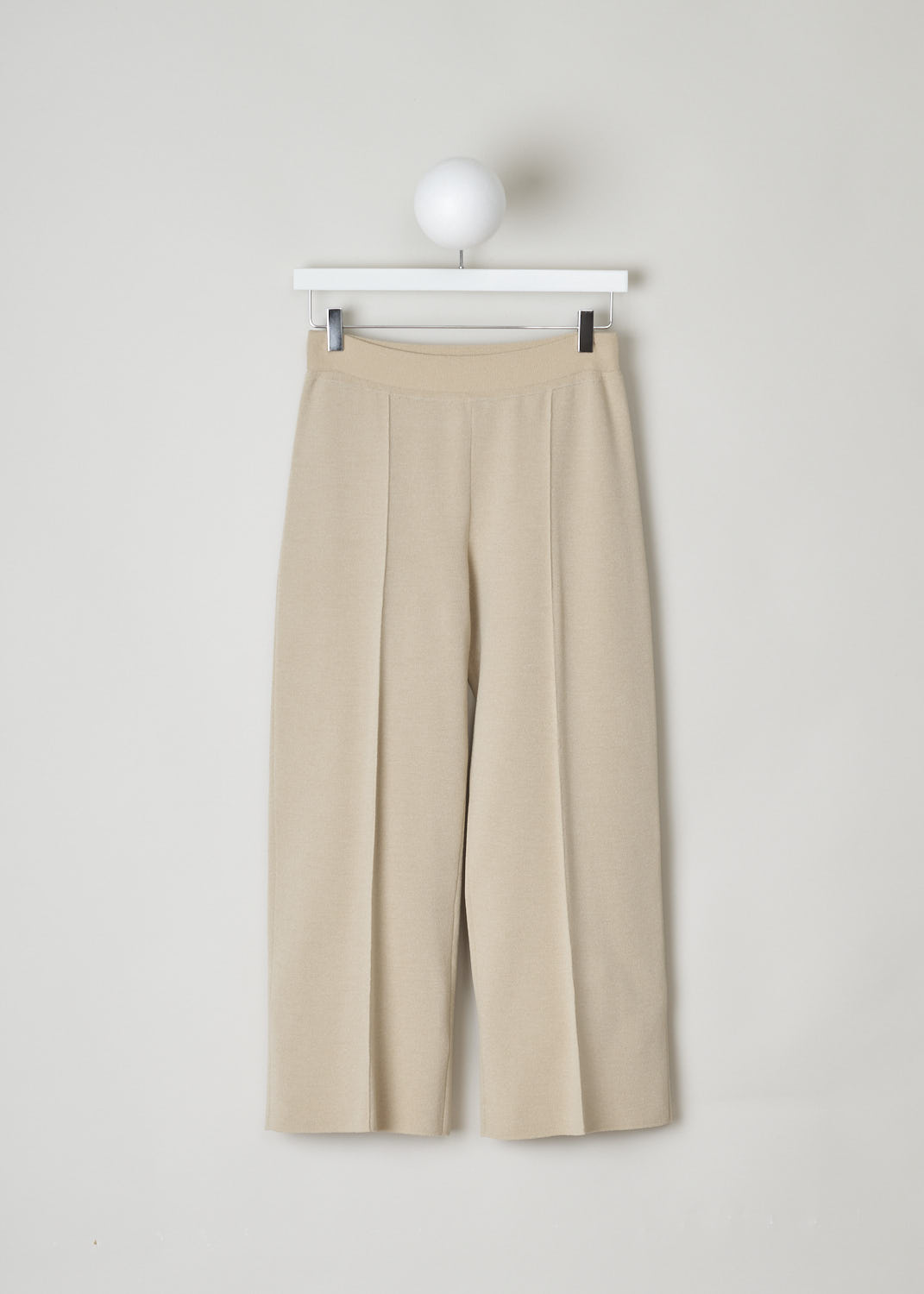 THE ROW, NUDE TAPERED TROUSERS, MARIA_PANT_3374Y205_NUDE, Beige, Front, These nude slip-on trousers feature an elasticated waistline. The trousers are form fitting throughout. Centre seam can be found front and back, creating a paneled look.
