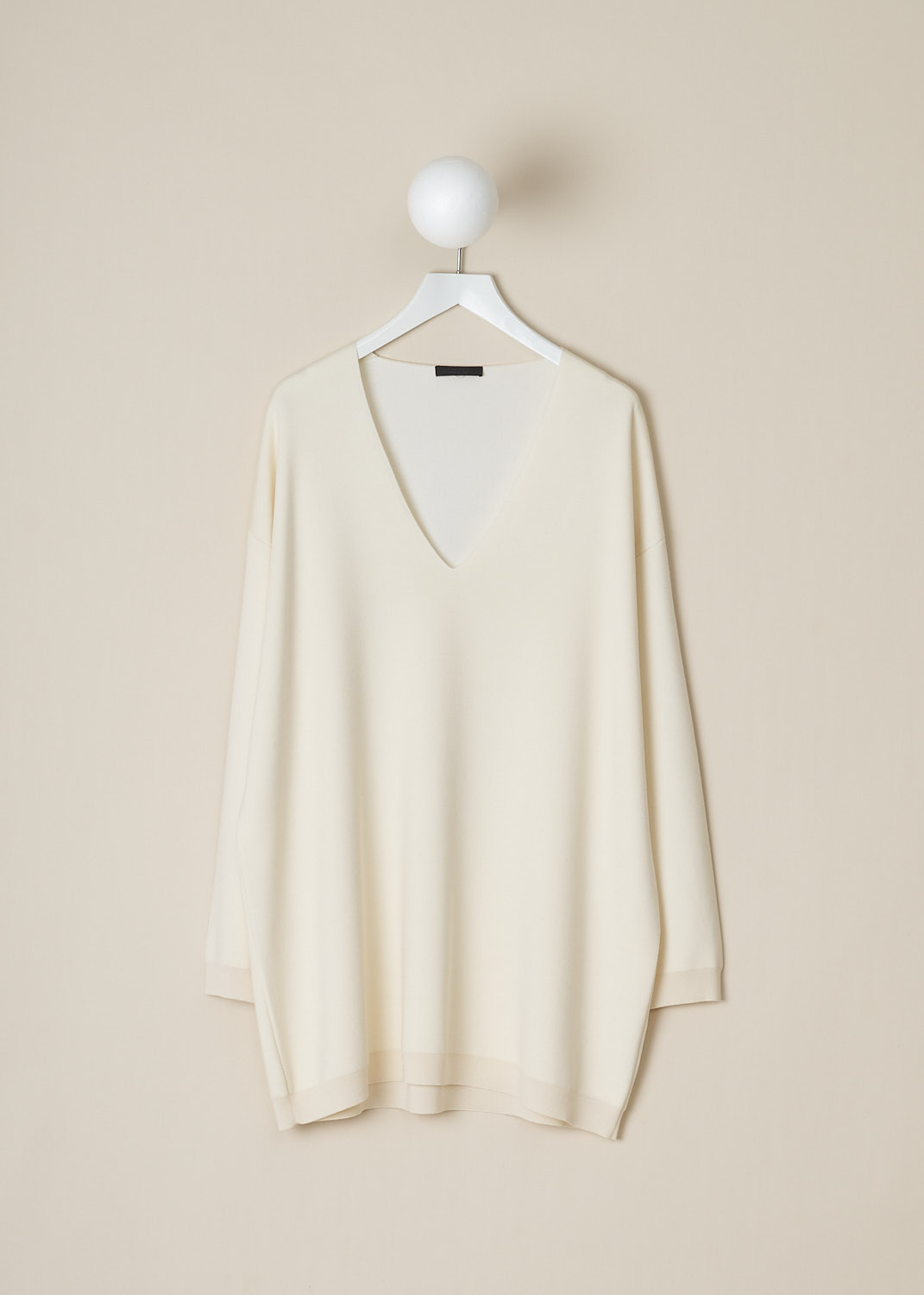 THE ROW, IVORY WHITE OVERSIZED MIRU TOP, MIRU_TOP_3227FI_BQ_IVORY, White, Front, This ivory white oversized Miru top has a deep V-neckline. The long sleeves have dropped shoulders and ribbed cuffs. The top has a straight, ribbed hemline. 
