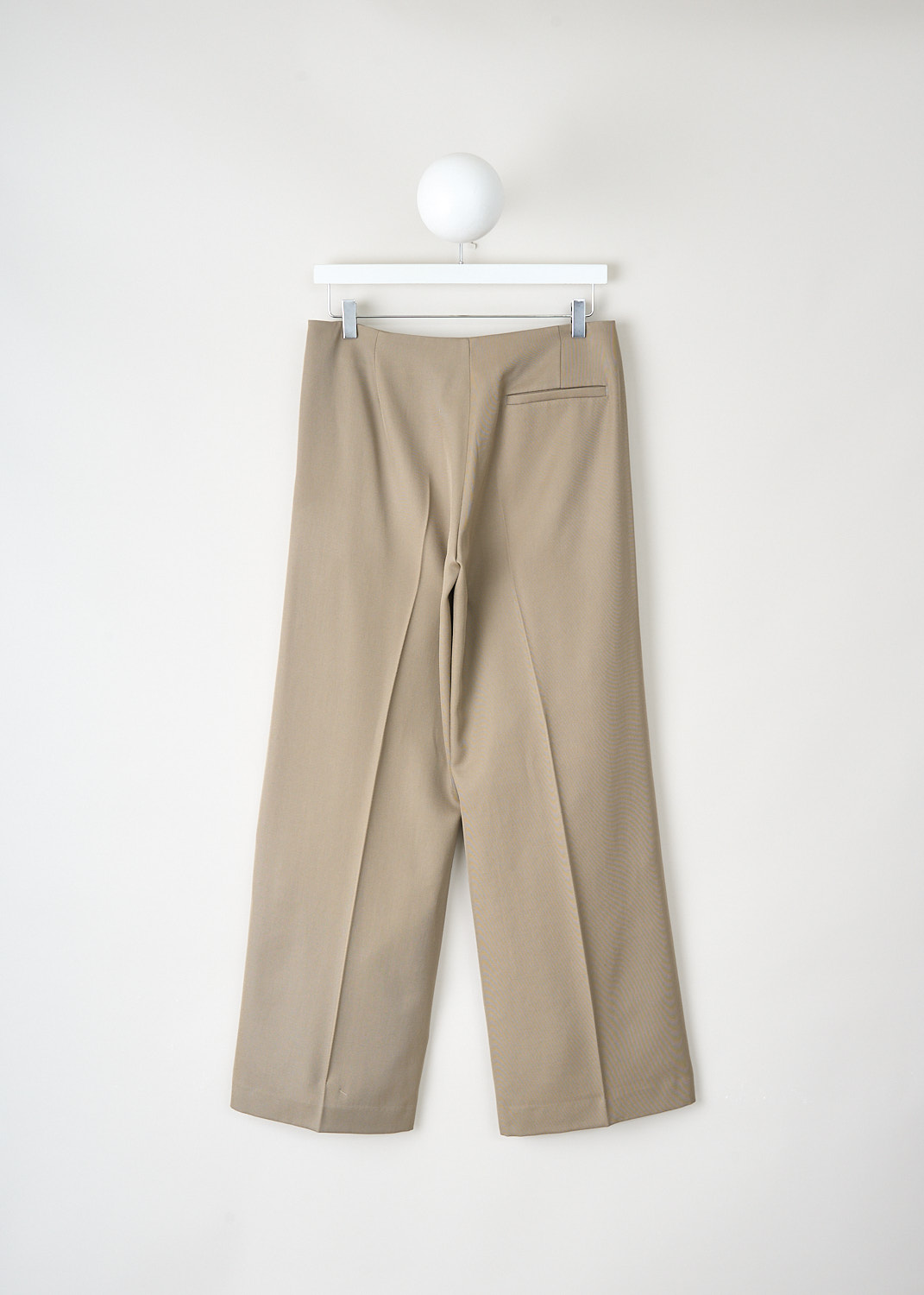 Back view of The Row Pipa trousers in Ash made from 100% virgin wool with a single welt pocket, available at Kiki’s Stocksale designer outlet Maastricht.