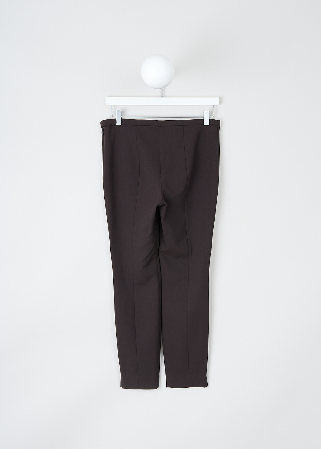 The Row, Sovino pants in Saddle Brown, SOVINO_PANT_5922W2119_SADDLE_BROWN, Brown, Back, These Sovino pants in Saddle Brown have a narrow waistband with a side zip closure. These pants have skinny pant legs with pressed creases. The hem has small side slits. 