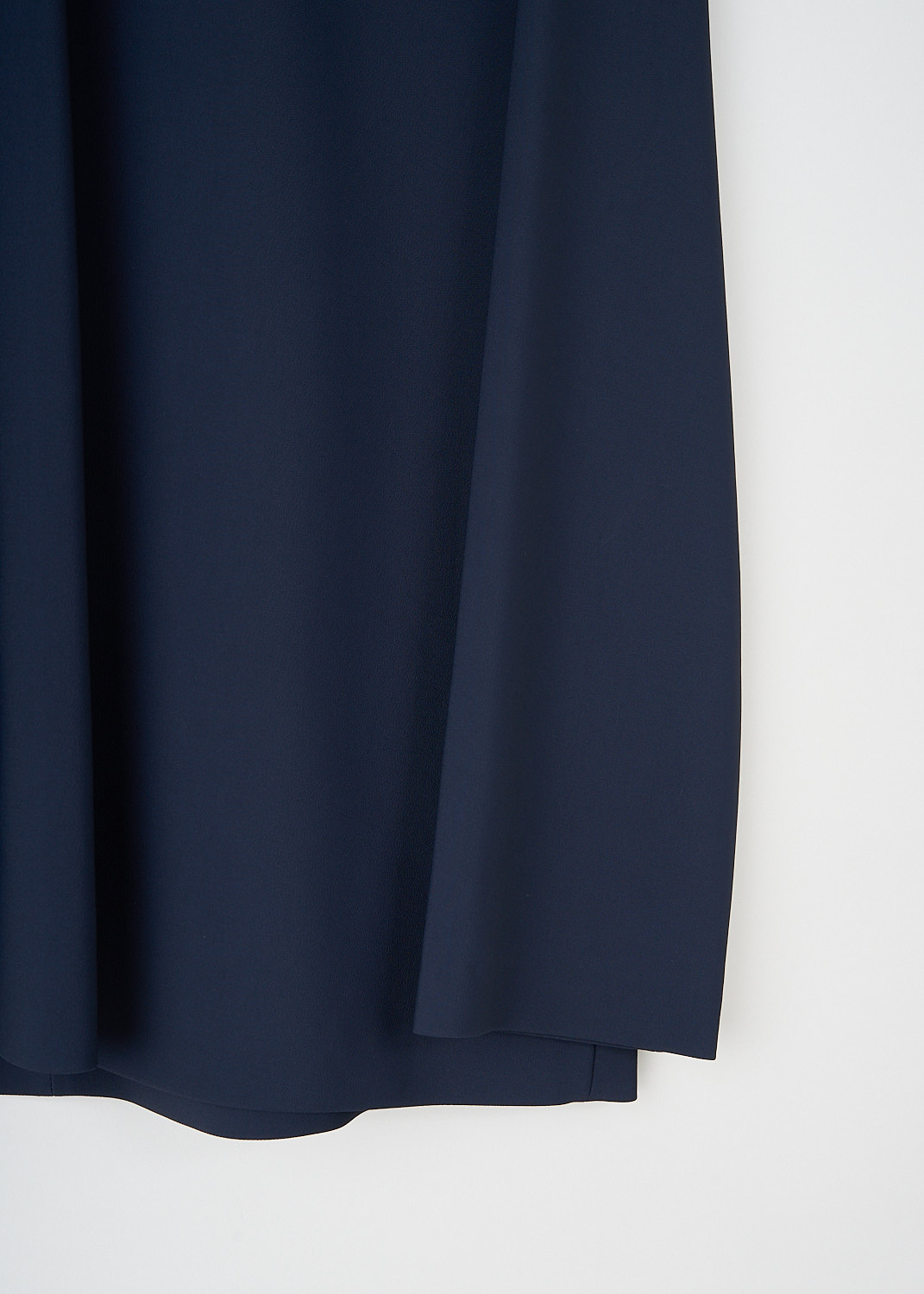 The Row, Tamar top in Dark Navy, TAMAR_TOP_5653_W1925_DARK_NAVY,  Blue, Detail, This Tamar top in dark navy has a round neckline a long sleeves with dropped shoulders. In the back, a concealed centre zip functions as the closure.
