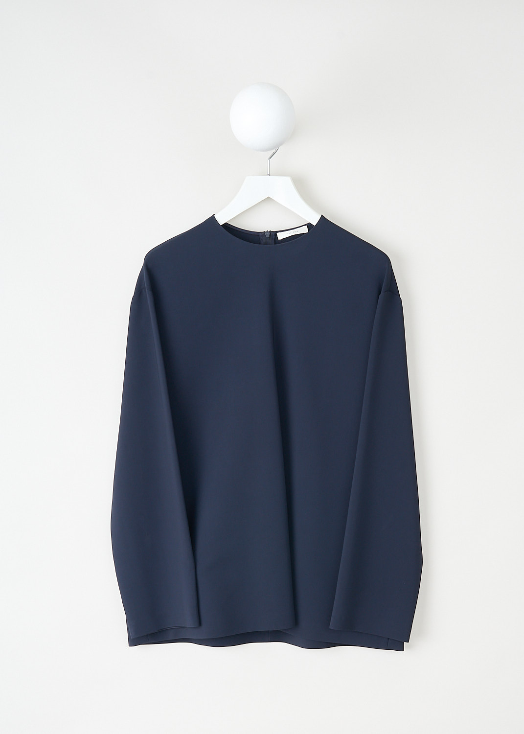 The Row, Tamar top in Dark Navy, TAMAR_TOP_5653_W1925_DARK_NAVY,  Blue, Front, This Tamar top in dark navy has a round neckline a long sleeves with dropped shoulders. In the back, a concealed centre zip functions as the closure.
