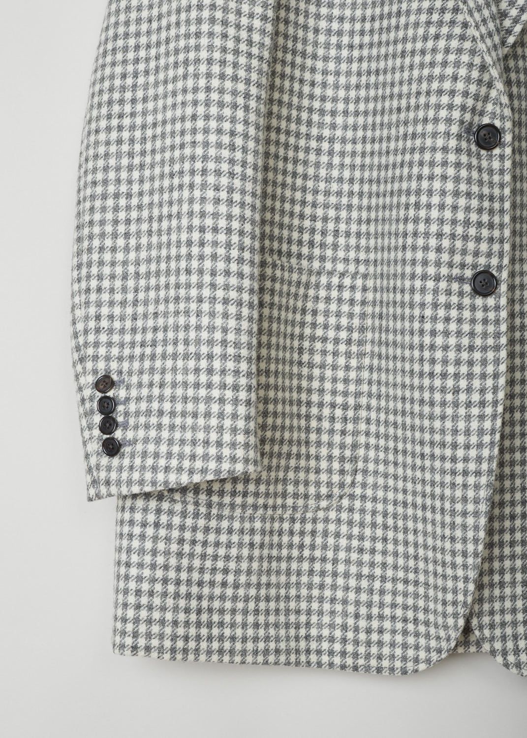 Thom Browne, Oversized jacket in houndstooth, FBC500A_06842_035_MED_GREY, Print, White, Grey, Detail, Classic Houndstooth printed oversized jacket. This single-breasted jacket features a notched lapel and a front button closure. The jacket has a single breast pocket, two patch pockets and three inner pockets. The long sleeves have buttoned cuffs. In the back, a centre vent can be found. 
