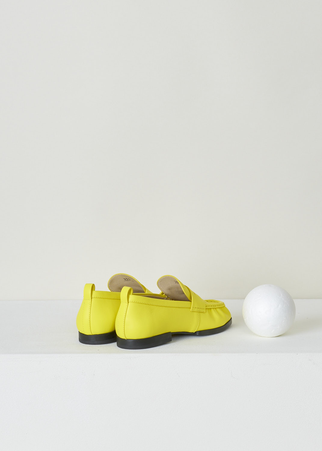 TODS, BRIGHT YELLOW PENNY LOAFERS, XXW02E0EC60PHXG009_PHX_HOLIDAY, Yellow, Back, These bright yellow slip-on penny loafers have a rounded toe and a decorative slotted leather strip over the upper side. Around the trim, the leather is subtly pleated. These loafers have black soles.
