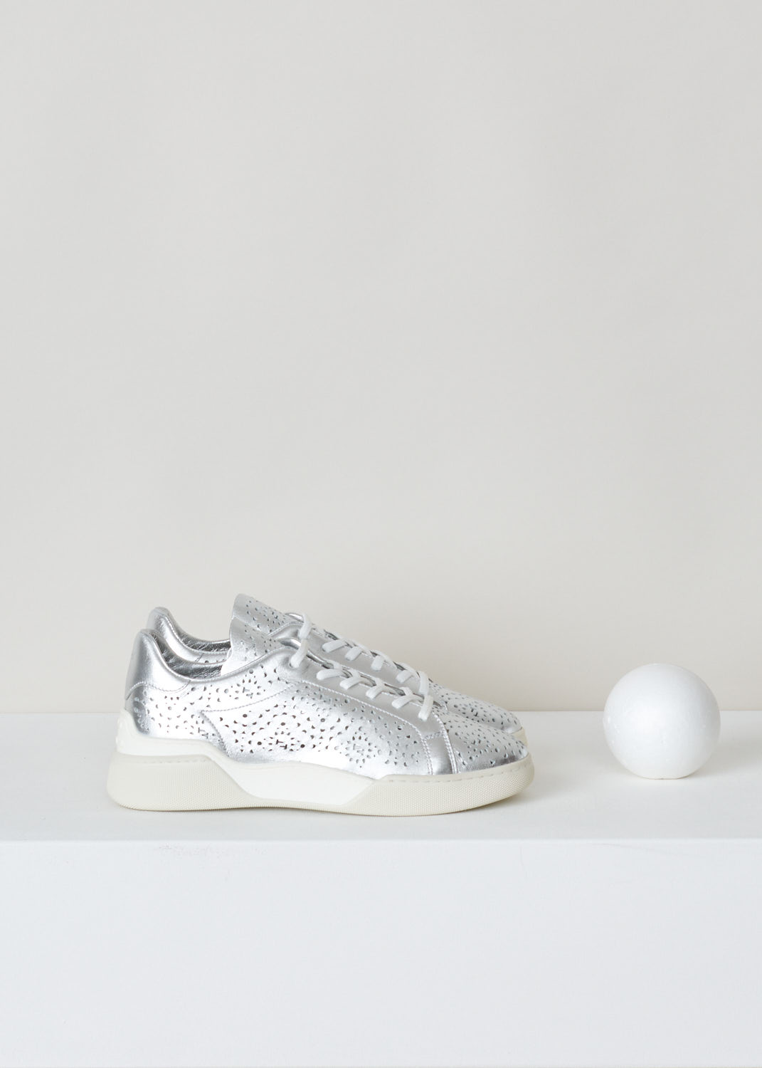 Tods, Silver coloured laser-cut sneakers, XXW31C0CU10MTZB200_argento, silver, side. Silver coloured sneakers, tooled with a laser to get all these lovely shapes cut out. All leather on the inside with a rubber sole. 