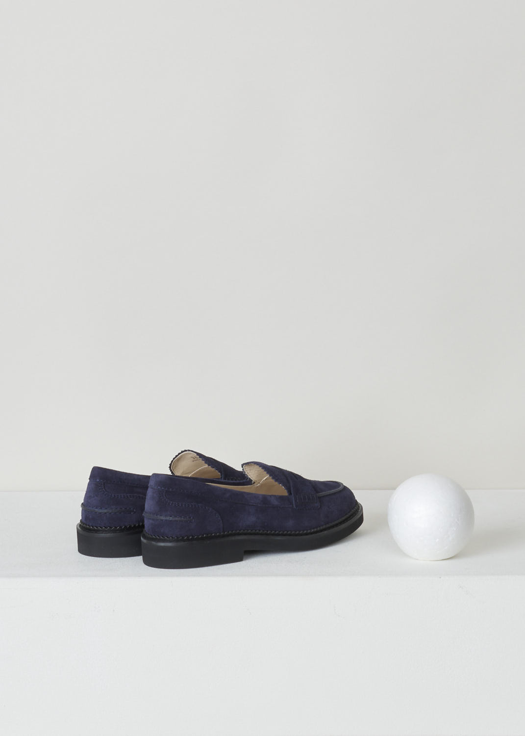 TODS, BLUE SUEDE PENNY LOAFERS, XXW76B0BP10RE0U824, Blue, Back, These blue suede slip-on penny loafers have a rounded toe and a decorative slotted leather strip over the upper side. The upper side being decorated with serrated edges. These loafers have black soles. 
