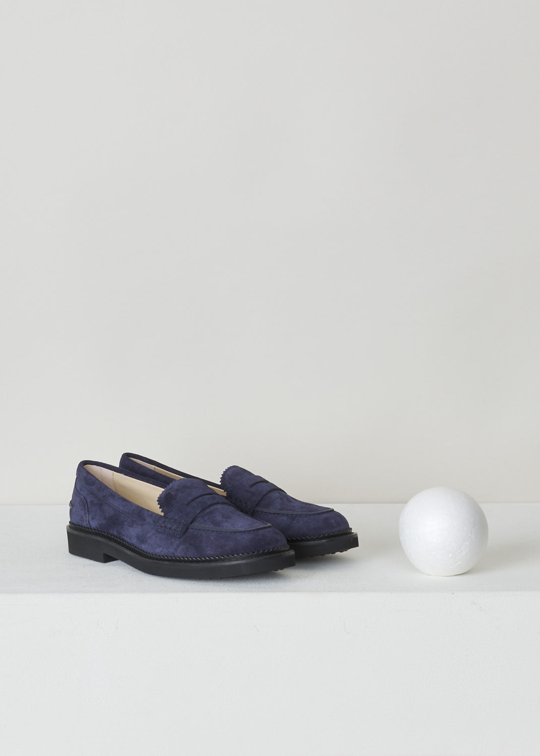 TODS, BLUE SUEDE PENNY LOAFERS, XXW76B0BP10RE0U824, Blue, Front, These blue suede slip-on penny loafers have a rounded toe and a decorative slotted leather strip over the upper side. The upper side being decorated with serrated edges. These loafers have black soles. 
