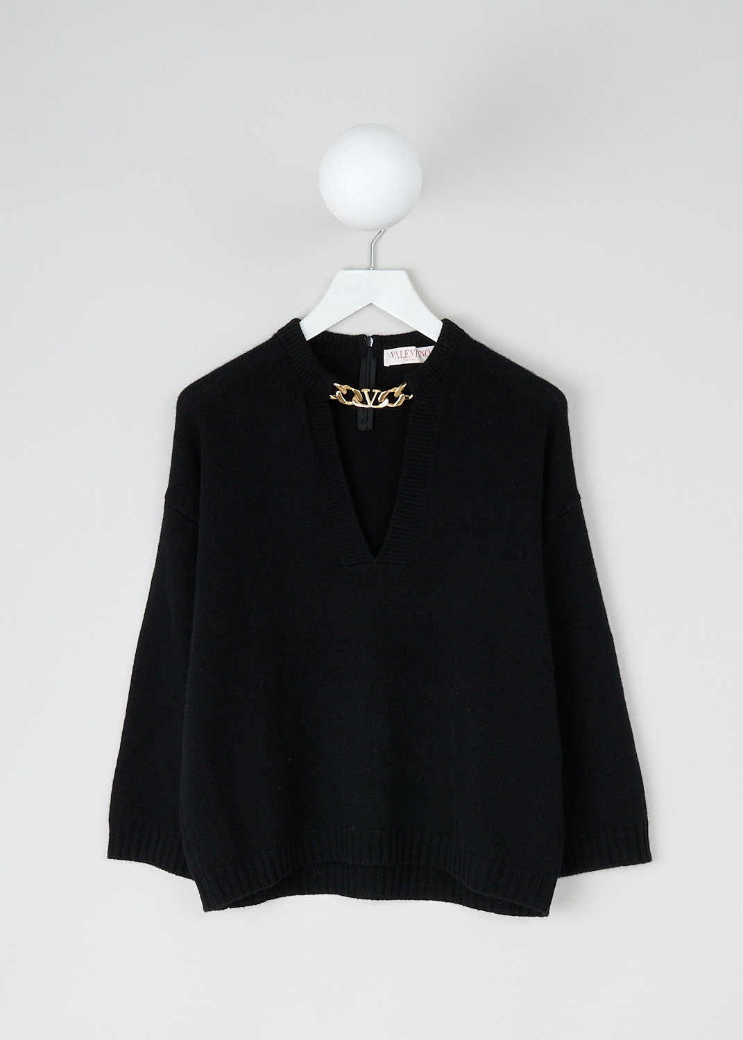 Valentino, Black sweater with gold-tone chain detail, 1B3KC37N7ER_0NO, Black, Front, 
This black cashmere-blend sweater has a plunging V-neckline with a gold-tone V-logo chain. The sweater has a slight A-line silhouette. 