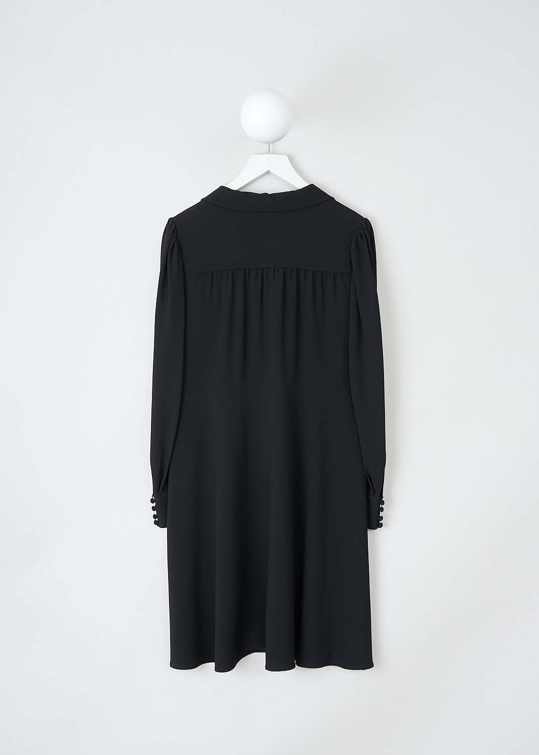 Valentino, Black maxi blouse dress, NB3VAE203D5_0N0, Black, Back, This black maxi blouse dress has a V-neckline with a notched lapel. The dress has a partial front button placket with fabric-covered buttons. The long sleeves have buttoned cuffs. The dress has a pleated bodice and a flared skirt. Crystal pleats run along the back yoke. 
