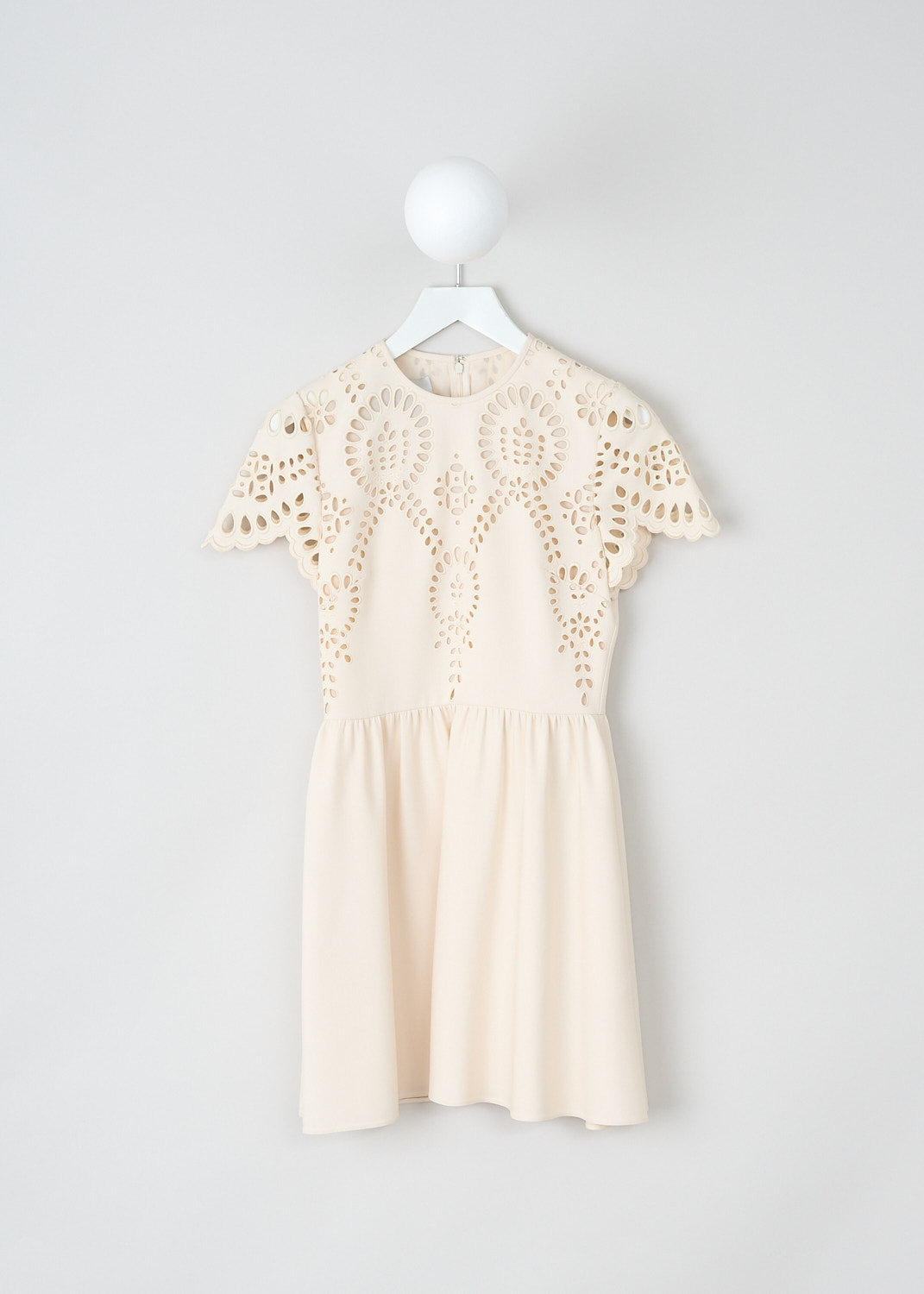 Valentino, Off-white broderie anglaise mini dress, WB3VAWF06GR_AO3, White, Beige, Front, This off-white broderie anglaise mini dress has a short-sleeve bodice with a round neckline and a flares skirt with slanted pockets.  The dress is fully lined. In the back, a concealed centre zip functions as the closure.
