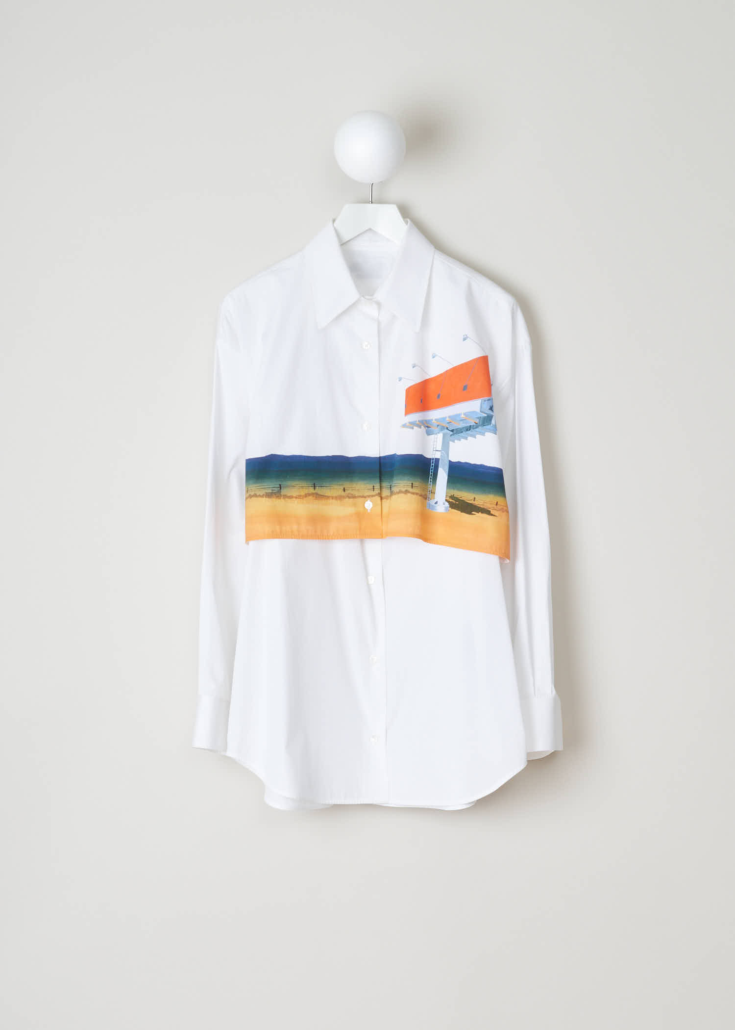 Calvin Klein 205W39nyc Double-layered cotton shirt 91WWTE04_C507A_191 front. This shirt is shaped for a loose fit, has a classic point collar and long sleeves. The layered chest and back panel have a multicoloured landscape print, which falls over a lower body part.